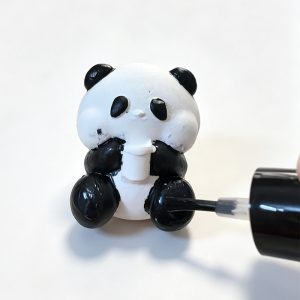 10 apply clear varnish on painted plaster craft doll